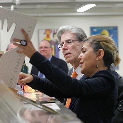 President Julio Frenk reviewing the University's special collections